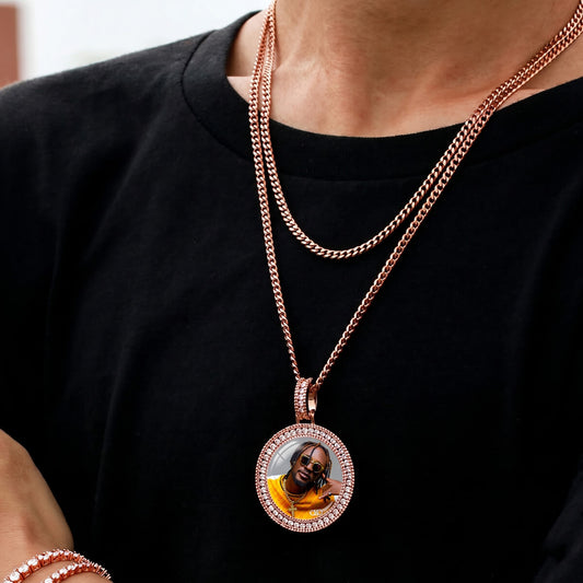 Person wearing iced out 3D picture pendant necklace
