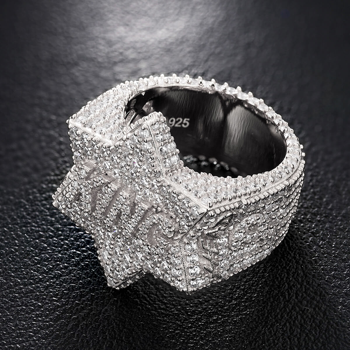 Side view of King Iced Out Five Star Ring in silver showing detailed stone placement and polished finish.