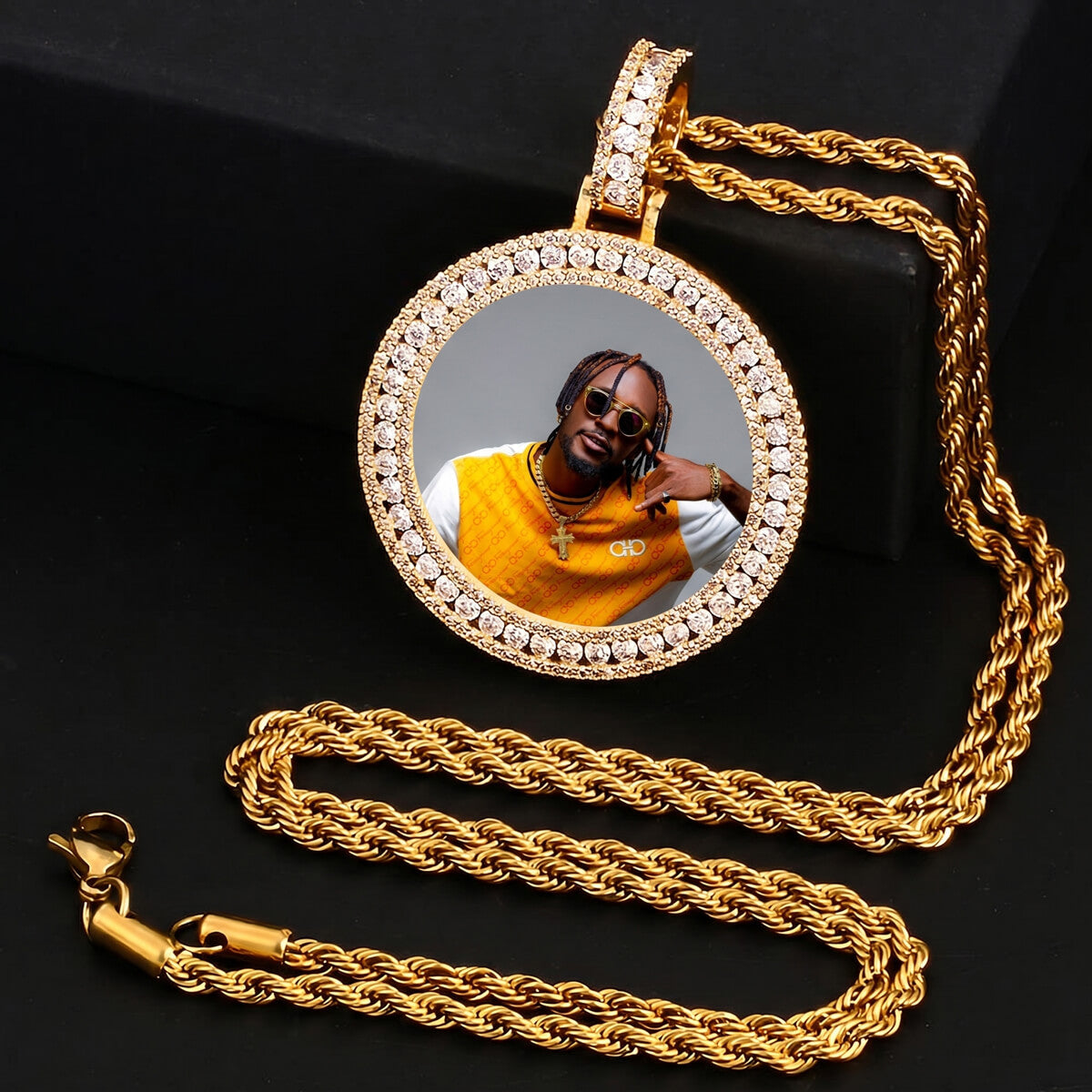 Close-up of iced out 3D picture pendant