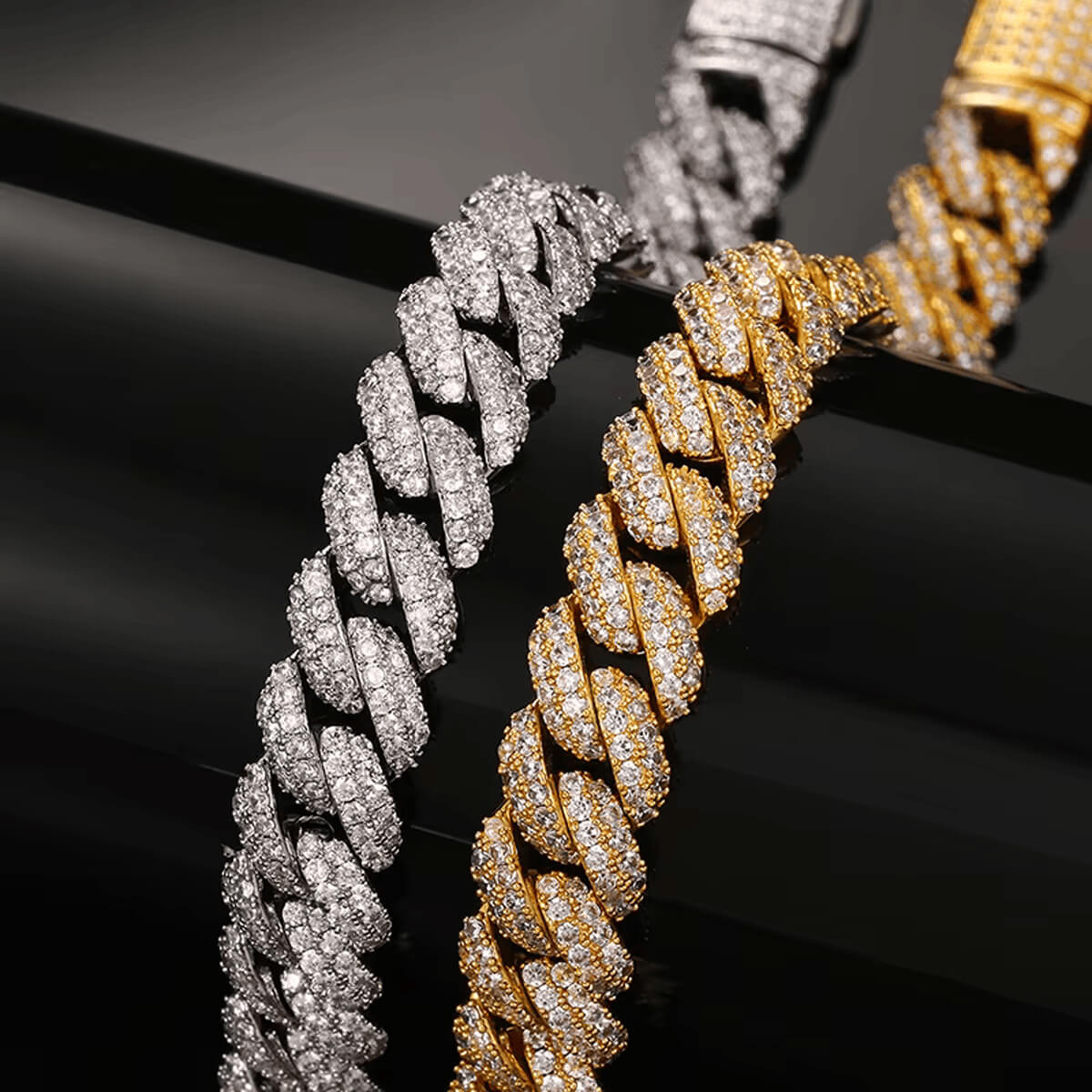 close view of gold and silver 8mm iced out Miami Cuban chain bracelets