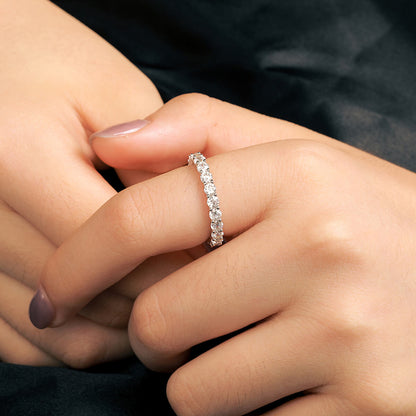 Close-up of 3mm Iced Out Eternity Band Ring on finger featuring brilliant white stones and polished silver finish.