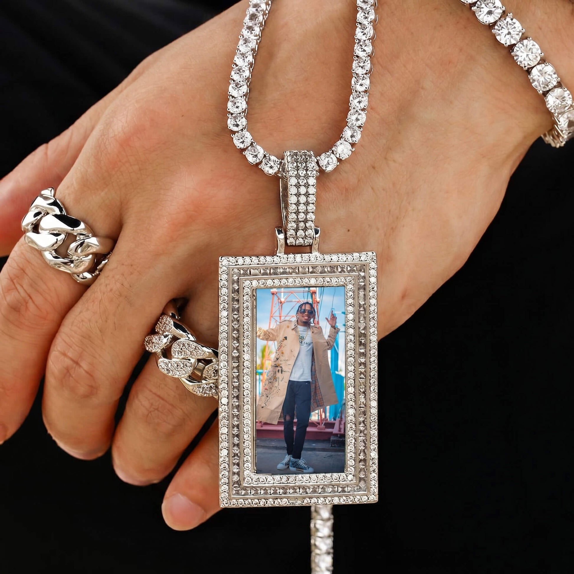 Close-up of iced out square photo pendant