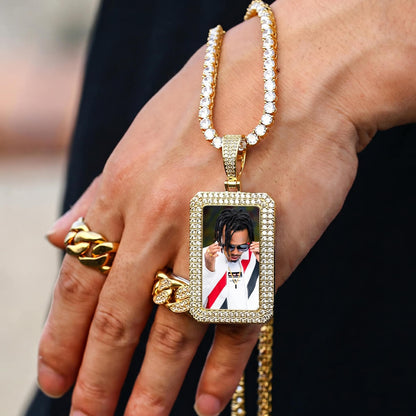 Hand wearing iced out square chain necklace