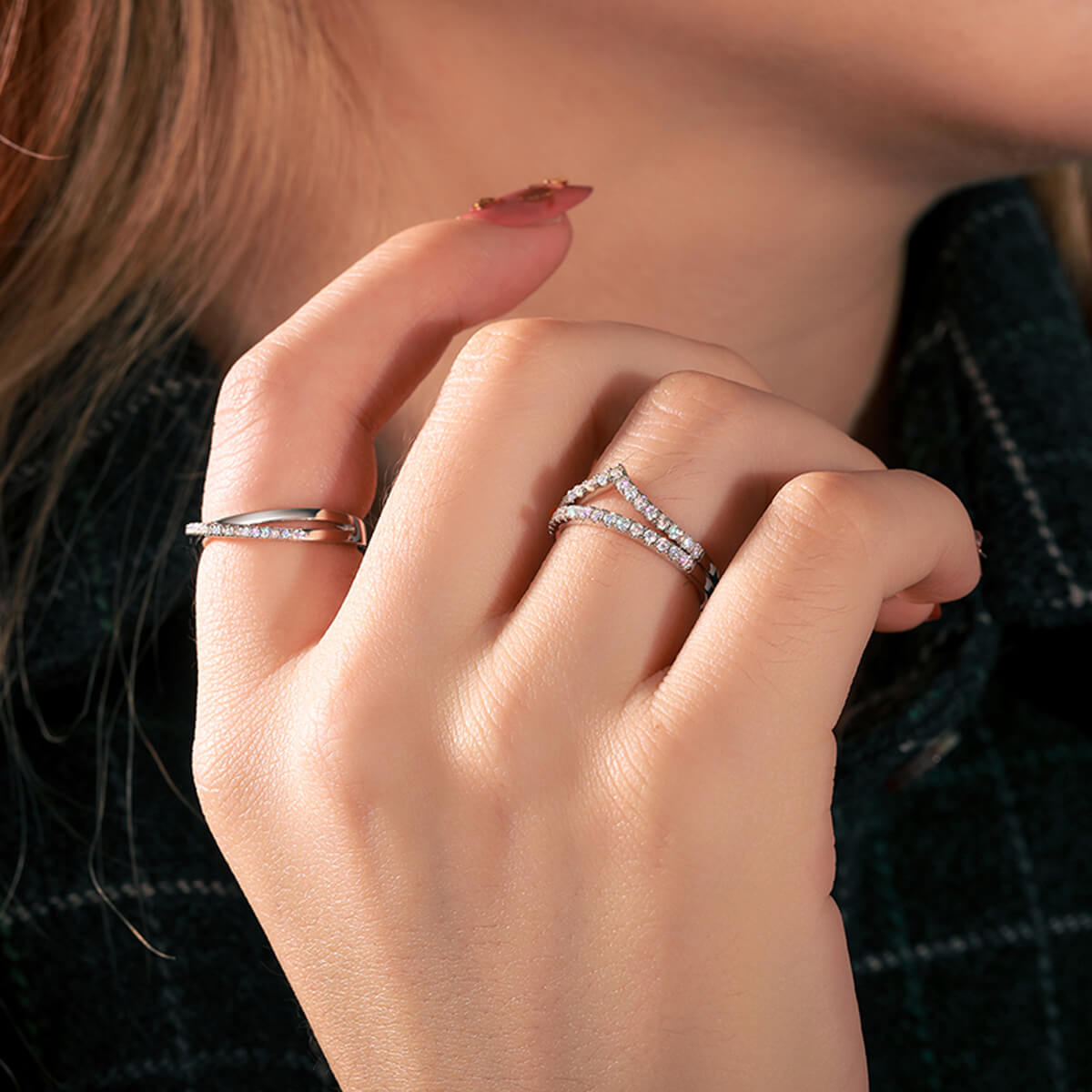 Close-up of Micro Pavé Half Eternity Wedding Ring on finger featuring sparkling white stones and a refined silver band.