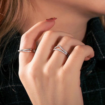 Close-up of Micro Pavé Half Eternity Wedding Ring on finger featuring sparkling white stones and a refined silver band.