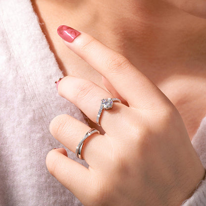 Woman wearing V-Shape Solitaire Engagement Ring in silver with a sparkling round center stone and elegant bridal style.