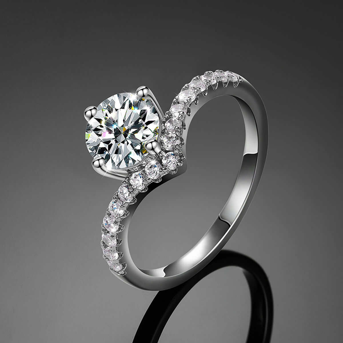 V-Shape Solitaire Engagement Ring in silver featuring a sparkling round center stone and elegant curved band design.