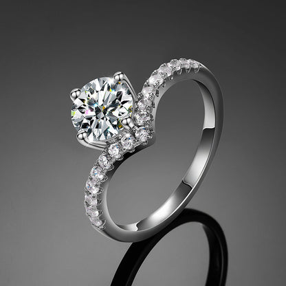 V-Shape Solitaire Engagement Ring in silver featuring a sparkling round center stone and elegant curved band design.