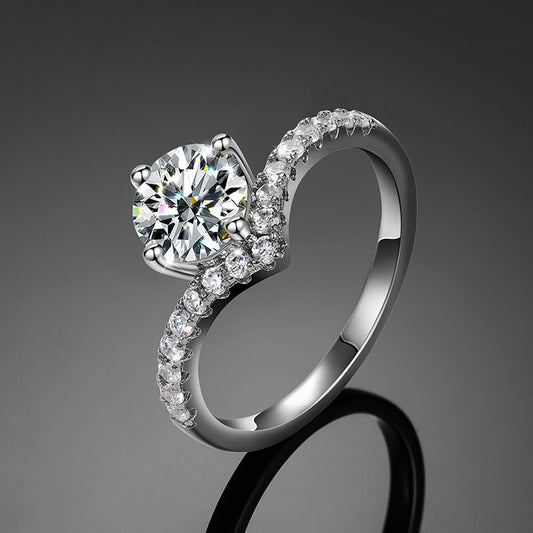 V-Shape Solitaire Engagement Ring in silver featuring a sparkling round center stone and elegant curved band design.