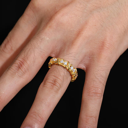 8mm gold screw pattern ring worn on finger close-up view
